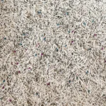 Mixed tofu and bentonite cat litter granules close up by YoVia Pet Products
